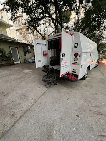 Magnet Plumbing service vehicle on-site for Grease Trap Cleaning in Guideboard